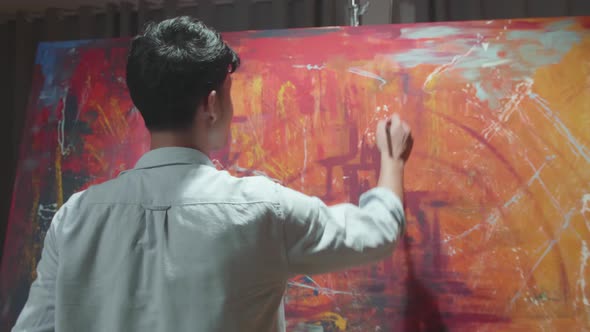 Male Using Paint Brush He Creates Modern Masterpiece Of The Painting