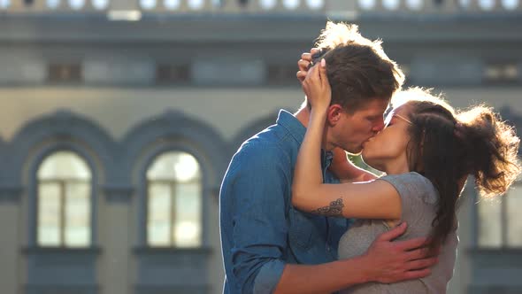 Young Passionate Couple Kissing Outdoors