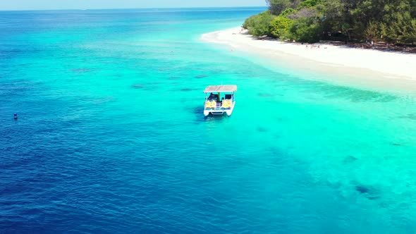 Aerial landscape of perfect shore beach adventure by aqua blue ocean with white sandy background of 