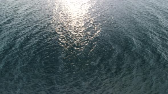 Aerial View From Above on Calm Azure Sea and Volcanic Rocky Shores