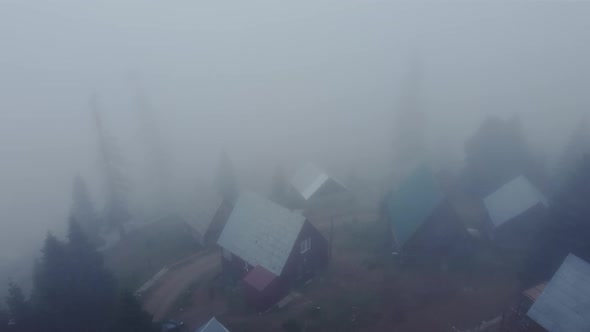 Misty Aerial View Of High Mountain Village