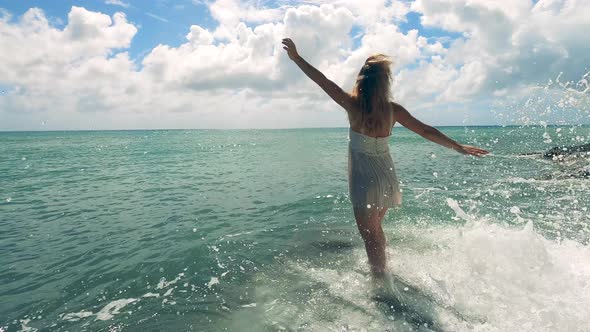 Beautiful Woman Being Relaxed at the Sea Coast