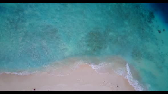 Aerial tourism of relaxing bay beach lifestyle by shallow lagoon with white sand background of a day