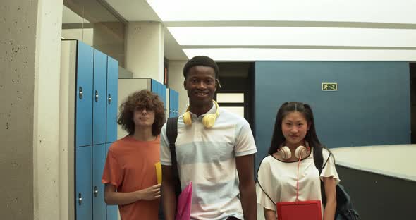 Portrait of Three Multiethnic Teenage Students Looking at Camera