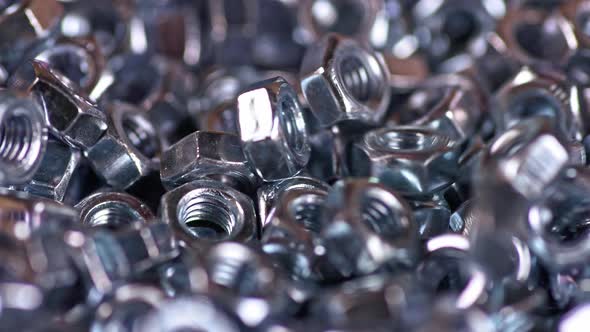 Metal Screwnuts Fall Neatly Into a Bunch of Other Nuts