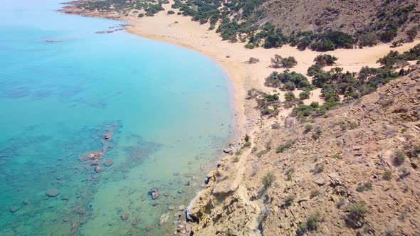 Aerial drone footage of famous turquoise beach of Agios Ioannis Greece