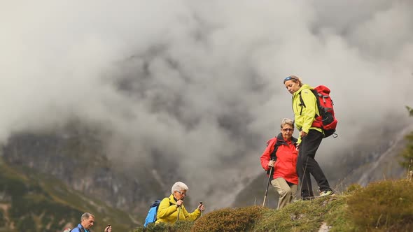 Guide Showing Seniors Mountains