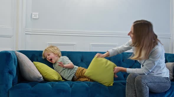 Mother Pillow Fight and Have Fun with Young Little Blond Boy