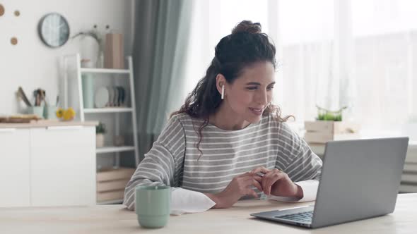 Young Housewife Finishing Video Call