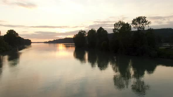 View of Fraser River. Colorful Summer Sunset. East of Vancouver, British Columbia, Canada.