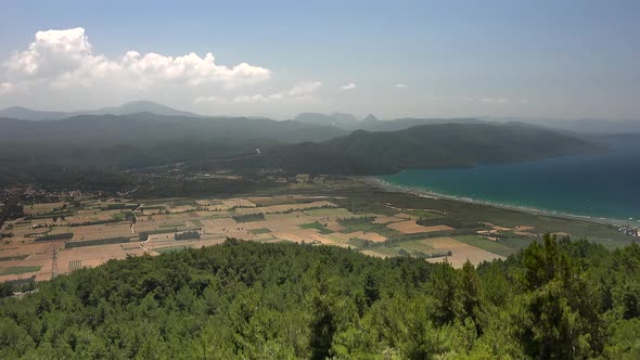 Narrow Long Fertile Alluvial Plain at The Forested Seaside