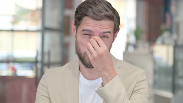 Young Man Having Headache