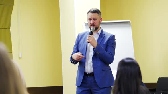 Businessman giving presentation to his Colleagues