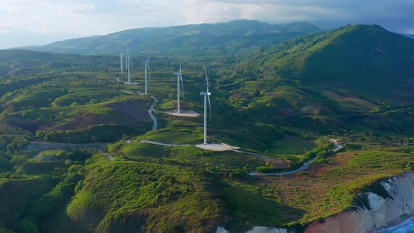 Wind turbines on cliffs of Larimar in Dominican Republic. Aerial forward