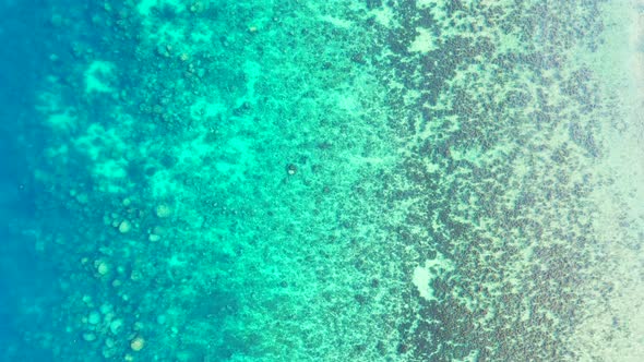 Beautiful calm sea background water texture, Green Blue Turquoise ocean with coral reef, high angle.