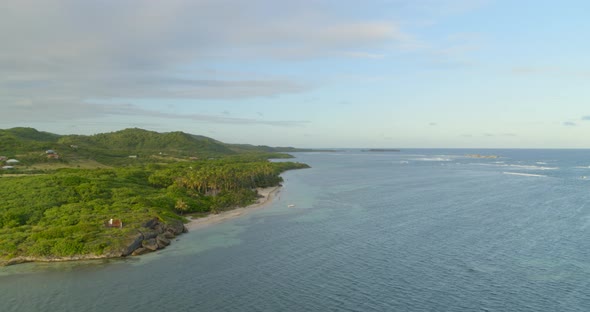 Aerial of a silent sea and green hilly coast, Cap Chevalier, Sainte-Anne