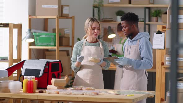 Portrait of Cheerful Diverse Colleagues at Work in Food Delivery Service