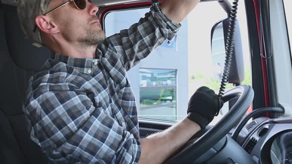 Truck Driver Taking Conversation Using CB Radio