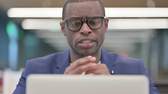 Young African Businessman Talking on Video Call on Laptop