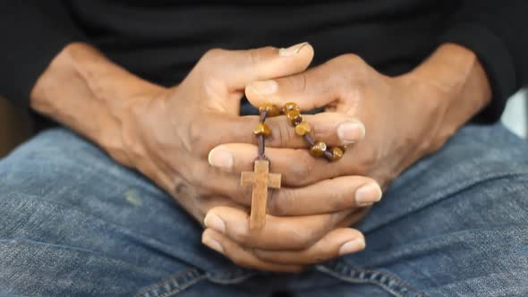 man sitting praying to god in silence with hands together stock video