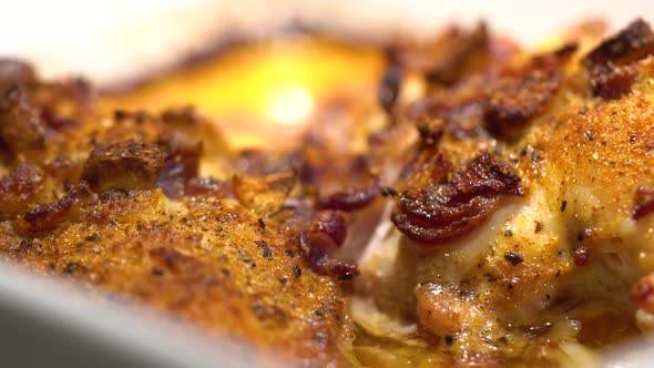 Roasted Chicken with Garlic and Seasoning on a Plate - Closeup