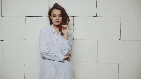 Portrait of model woman. Female model in stylish clothes posing in studio