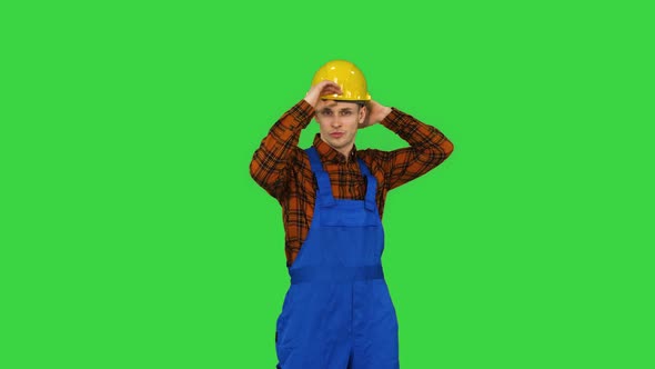 Single Construction Worker Puts on Safety Hat and Does Some Cool Dancing on a Green Screen, Chroma