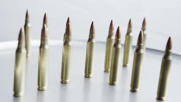 Cinematic rotating shot of bullets on a metallic surface - BULLETS 059