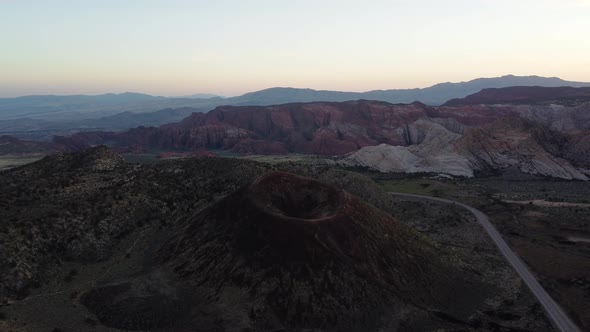 Aerial shot orbiting Santa Clara volcano in the mountains of Utah at sunset. St George, Utah