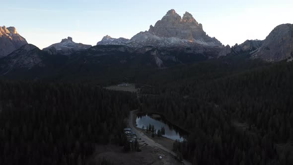 Dolomites mountains and alpine lake at sunrise