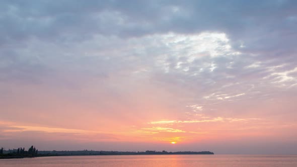 Rising Sun Behind The Clouds, River, Timelapse