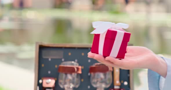  Slow Motion Gift Video. Close Up Women Giving Red Box with White Silk Ribbon