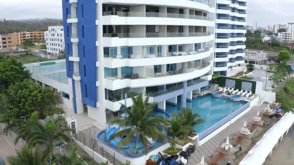 Aerial view of a swimming pools for VIP's in front of a high building