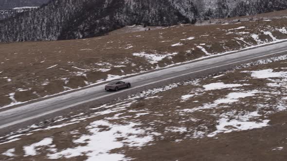 Car in the Mountains of the Caucasus in Winter