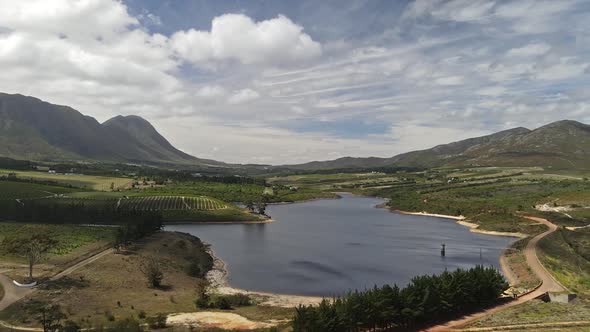 Winelands area in South Africa with lakes, vinyards, mountains and farms.