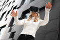 Woman Gesturing Using Virtual Reality Glasses In Metaverse Business - PhotoDune Item for Sale