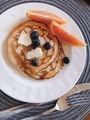 Pancakes with Butter and Blueberries on a White Plate with Two Blood Orange Slices - PhotoDune Item for Sale