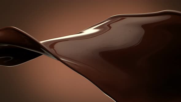 Super Slow Motion Shot of Twisting Chocolate Splash on Brown Gradient Background at 1000 Fps