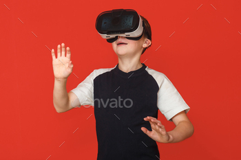  game on a red background. 3D gadget technology. Cardboard VR headset glasses