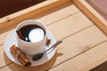 americano espresso coffee in classic white cup. coffee with cinnamon and anice on wooden tray.  - PhotoDune Item for Sale