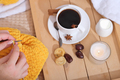 Woman knitting with a cup of cinnamon coffee, snacks and candle. cozy home hobby,  - PhotoDune Item for Sale