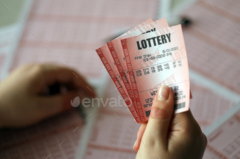the lottery ticket with complete row of numbers on the lottery blank sheets background. Gambling concept