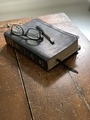 A Black Leather Bible Sits atop an Old Weathered Wooden Table - PhotoDune Item for Sale