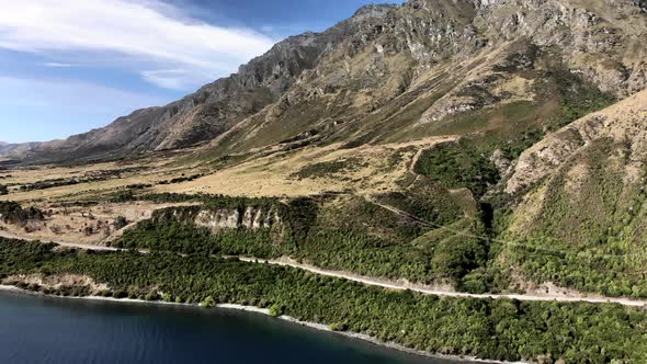 Winding road around lake Wakatipu, favourite holiday spot, South Island, New Zealand - aerial