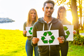 Environmental protection team holding recycling symbol placards - PhotoDune Item for Sale