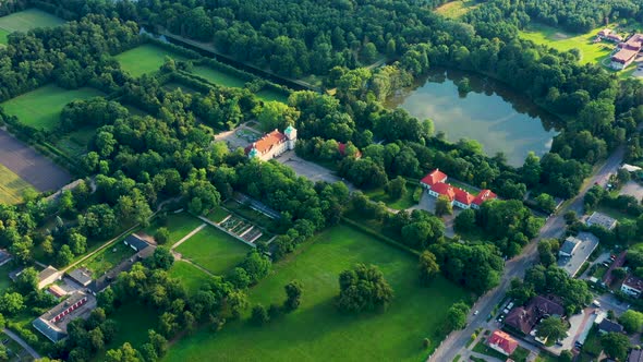 Beautiful avenue of trees of Nieborow Palace, a Baroque style residence in Poland. Colourful foliage