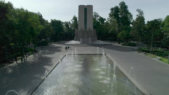 Pull front above a fountain at a monument in Mexico City