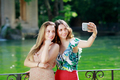 Girls smile and take a selfie together. - PhotoDune Item for Sale