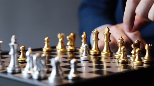 Cropped Shot of Businessman Playing Chess