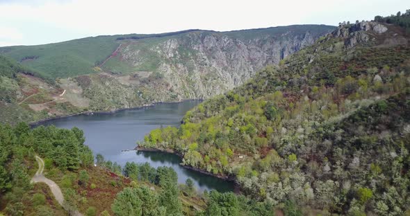 Flying over a river at the Sil Canyon a gorge 